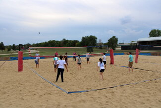 General photo of everyone playing volleyball #2