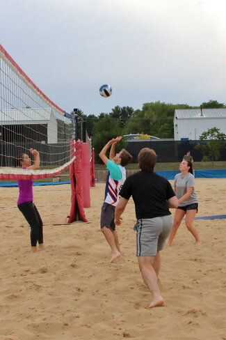 General photo of everyone playing volleyball #1