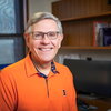 Kelvin Droegemeier standing in front of a computer.
